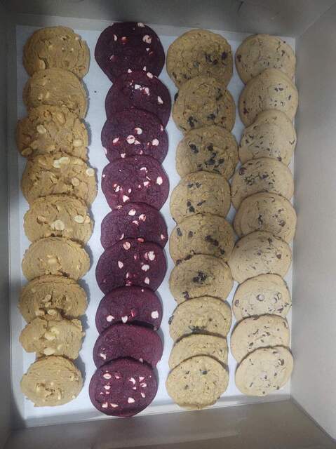 Homemade chocolate chip cookies, peanut butter cookies, oatmeal raisin cookies and red velvet cookies
